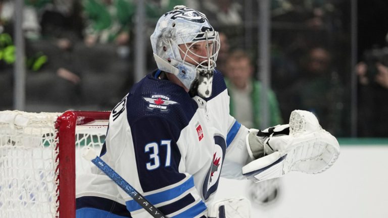 Winnipeg Jets goaltender Connor Hellebuyck minds the net during an NHL hockey game against the Dallas Stars in Dallas, Thursday, Feb. 29, 2024. (AP Photo/Tony Gutierrez) 