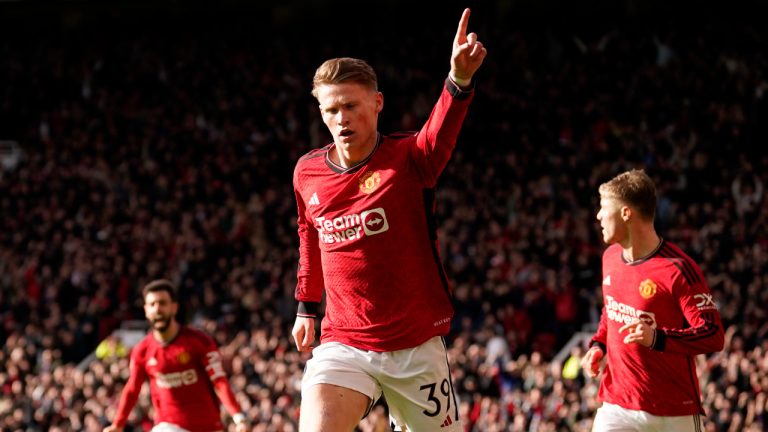 Manchester United's Scott McTominay, cantre, celebrates after scoring his side's opening goal during the FA Cup quarterfinal soccer match between Manchester United and Liverpool at the Old Trafford stadium in Manchester, England, Sunday, March 17, 2024. (Dave Thompson/AP) 