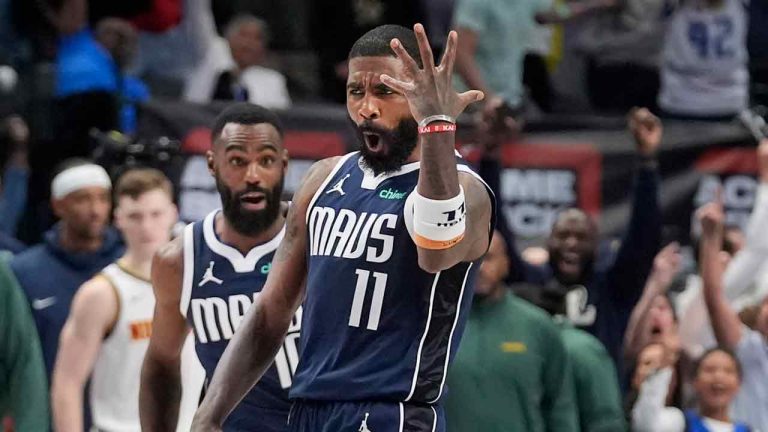 Dallas Mavericks guard Kyrie Irving (11) reacts as teammate Tim Hardaway Jr. runs up after Irving scored the game-winning shot ending the second half of an NBA basketball game against the Denver Nuggets in Dallas, Sunday, March 17, 2024. (LM Otero/AP)