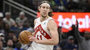 Toronto Raptors forward Kelly Olynyk (41) brings the ball up the court during the second half of an NBA basketball game against the Orlando Magic, Sunday, March 17, 2024, in Orlando, Fla. (AP Photo/Phelan M. Ebenhack) 