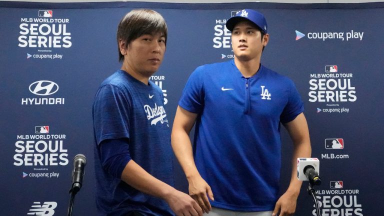 Los Angeles Dodgers' Shohei Ohtani, right, and his interpreter, Ippei Mizuhara, leave after at a news conference ahead of a baseball workout at Gocheok Sky Dome in Seoul, South Korea, Saturday, March 16, 2024. (Lee Jin-man/AP) 