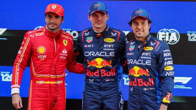 Fastest qualifier Red Bull driver Max Verstappen, centre, of the Netherlands stands with second fastest, Ferrari driver Carlos Sainz, left, of Spain and Red Bull teammate and third placed Sergio Perez of Mexico following the qualifying session for the Australian Formula One Grand Prix at Albert Park, in Melbourne, Australia, Saturday, March 23, 2024. (AP)