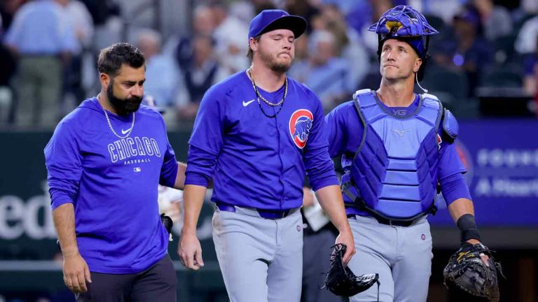 Chicago Cubs starting pitcher Justin Steele, center, leaves after injuring his left leg during the fifth inning of the team's baseball game against the Texas Rangers, Thursday, March 28, 2024 in Arlington, Texas. (Gareth Patterson/AP)