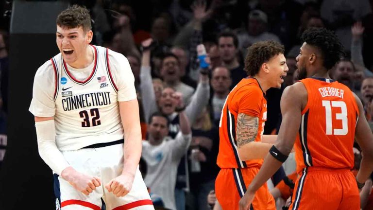 UConn center Donovan Clingan (32) celebrates after his dunk against Illinois during the first half of the Elite 8 college basketball game in the men's NCAA Tournament, Saturday, March 30, 2024, in Boston. (Michael Dwyer/AP)