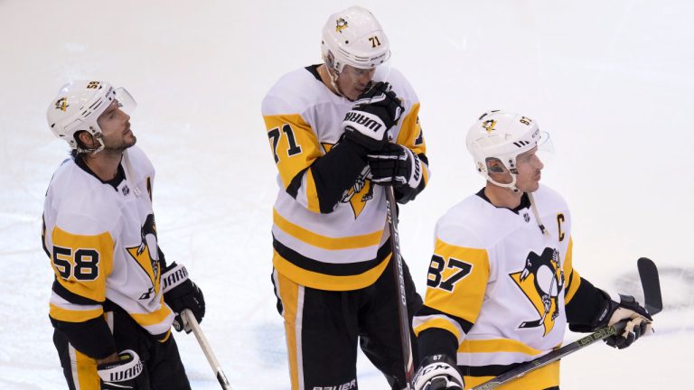 Pittsburgh Penguins centre Sidney Crosby (87), centre Evgeni Malkin (71) and defenceman Kris Letang (58) react after losing to the Montreal Canadiens in NHL Eastern Conference Stanley Cup playoff action in Toronto on Friday, August 7, 2020. (Frank Gunn/CP)