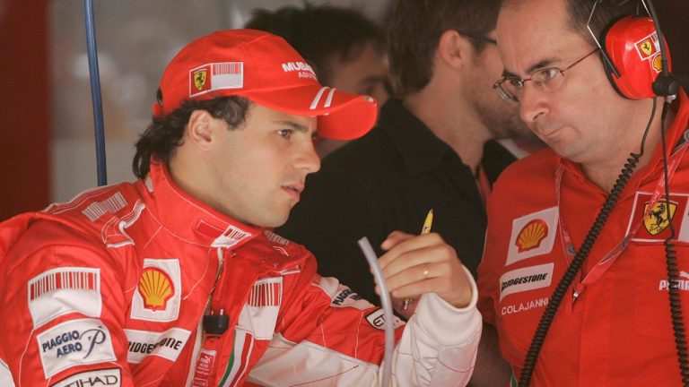 Former Ferrari driver Felipe Massa of Brazil, left, speaks with a team member during free practice at the Catalonian racetrack in Montmelo, near Barcelona, Spain, Friday, April 25, 2008. (Paul White/AP) 