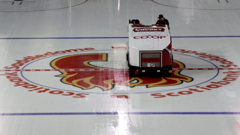 An ice-cleaning machine crosses over the Calgary Flames logo. (Jeff McIntosh/CP)