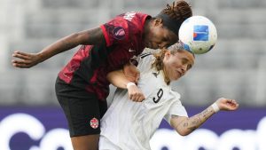 Canada defender Kadeisha Buchanan, left, and Costa Rica forward Maria Paula Salas vie for the ball during the first half of a CONCACAF Gold Cup women's soccer tournament quarterfinal Saturday, March 2, 2024, in Los Angeles. (AP Photo/Ryan Sun)