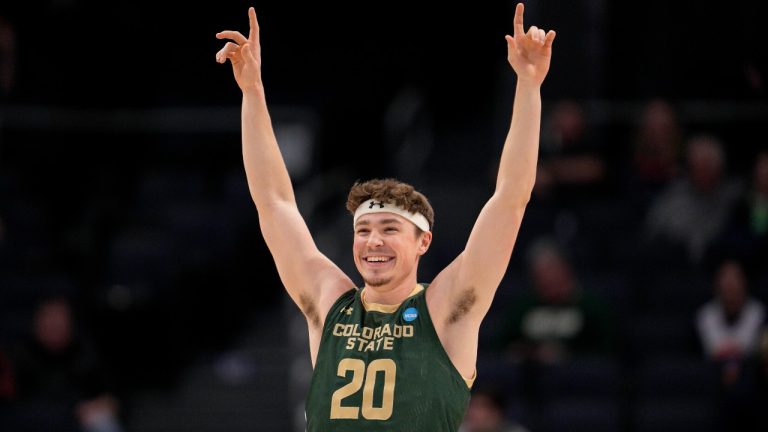 Colorado State's Joe Palmer reacts to a Jack Payne free throw during the second half of a First Four college basketball game against Virginia in the NCAA Tournament in Dayton, Ohio, Tuesday, March 19, 2024. (AP Photo/Jeff Dean)