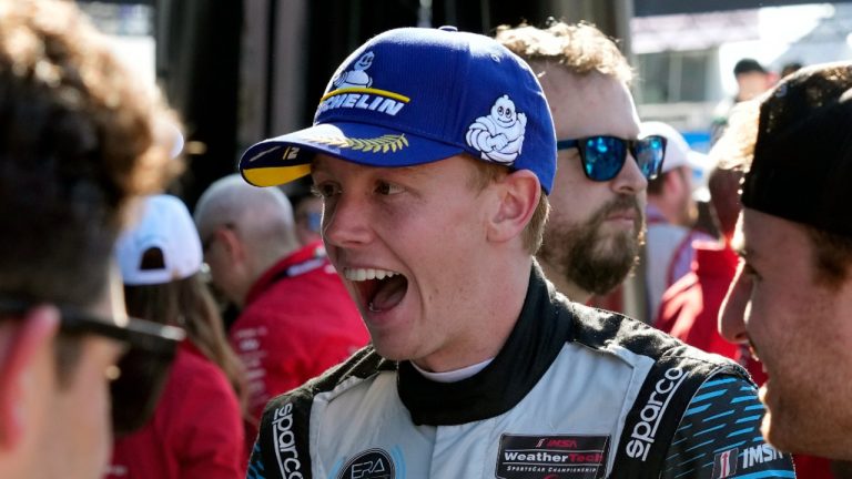 Connor Zilisch greets team members after the Rolex 24 hour auto race at Daytona International Speedway, Sunday, Jan. 28, 2024, in Daytona Beach, Fla. Connor Zilisch is coming off back-to-back sports car class victories at Daytona and Sebring and the teen sensation now turns his attention to NASCAR. (AP Photo/John Raoux)