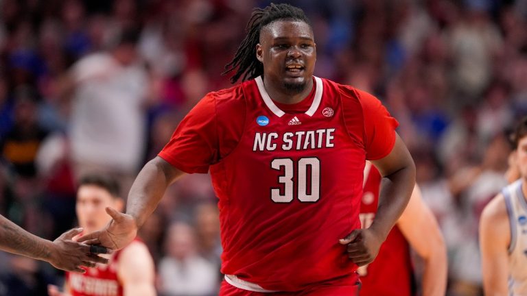 North Carolina State's DJ Burns Jr. reacts after a basket against Duke during the second half of an Elite Eight college basketball game in the NCAA Tournament in Dallas, Sunday, March 31, 2024. (AP Photo/Tony Gutierrez)