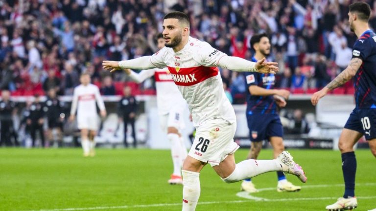 Stuttgart's Deniz Undav, front, celebrates after scoring his side's third goal during the Bundesliga soccer match between VfB Stuttgart and 1. FC Heidenheim in Stuttgart, Germany, Sunday, March 31, 2024. The match ended in a 3-3 draw. (Tom Weller/dpa via AP)