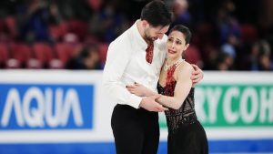 Deanna Stellato-Dudek and Maxime Deschamps of Canada react following their free skate program in the pairs competition during the 2024 ISU World Figure Skating Championships. (Christinne Muschi/CP)