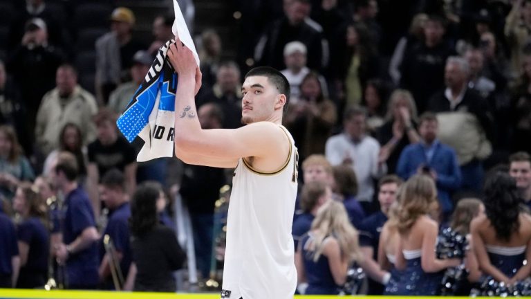 Purdue's Zach Edey applauds as he heads off the court following a second-round college basketball game against Utah State in the NCAA Tournament, Sunday, March 24, 2024 in Indianapolis. (Michael Conroy/AP Photo)