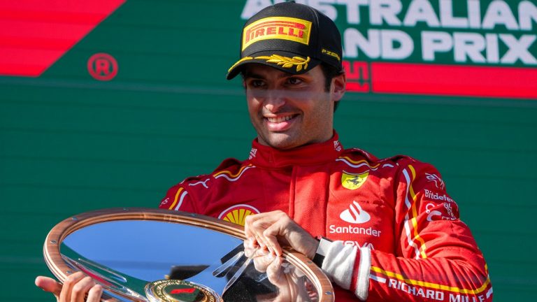 Ferrari driver Carlos Sainz of Spain celebrates on the podium after winning the Australian Formula One Grand Prix at Albert Park, in Melbourne, Australia, Sunday, March 24, 2024. (Asanka Brendon Ratnayake/AP)