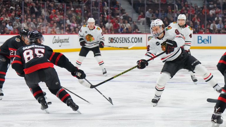 Connor Bedard of the Chicago Blackhawks shoots the puck against Jake Sanderson and Mathieu Joseph of the Ottawa Senators during the second period at Canadian Tire Centre on March 28, 2024, in Ottawa. (Getty Images)