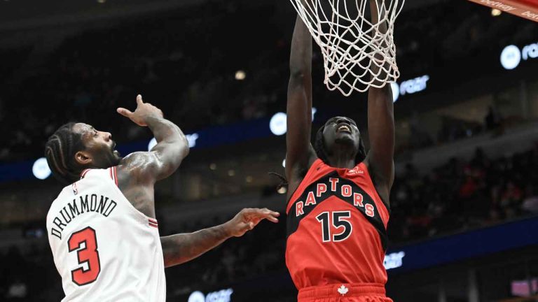 Toronto Raptors forward Mouhamadou Gueye (15) scores against Chicago Bulls center Andre Drummond (3) during the second half of a preseason NBA basketball game. (Matt Marton/AP)