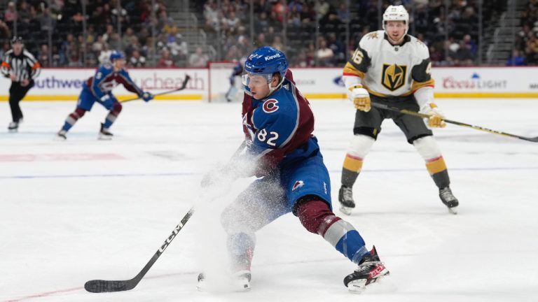 Colorado Avalanche centre Ivan Ivan (82) collects the puck as Vegas Golden Knights left wing Jonas Rondbjerg, right, defends in the first period of a preseason NHL hockey game Monday, Sept. 25, 2023, in Denver. (David Zalubowski/AP)