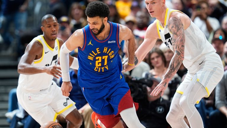 Denver Nuggets guard Jamal Murray, center, pursues the ball as Utah Jazz guard Kris Dunn, left, and forward Luka Samanic defend during the second half of an NBA basketball game Saturday, March 9, 2024, in Denver. (David Zalubowski/AP)