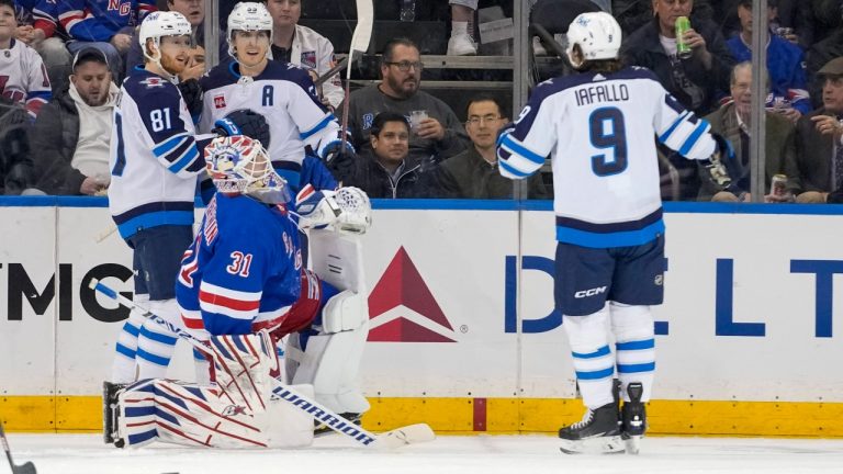 New York Rangers goaltender Igor Shesterkin (31) reacts as Winnipeg Jets center Mark Scheifele (55) celebrates after scoring with left wing Kyle Connor (81) and left wing Alex Iafallo (9) during the second period of an NHL hockey game, Tuesday, March 19, 2024, at Madison Square Garden in New York. (Mary Altaffer/AP)