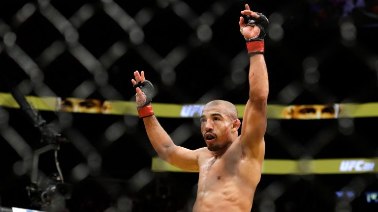 Jose Aldo celebrates after defeating Frankie Edgar during their featherweight championship mixed martial arts bout at UFC 200, Saturday, July 9, 2016, in Las Vegas. (AP Photo/John Locher)