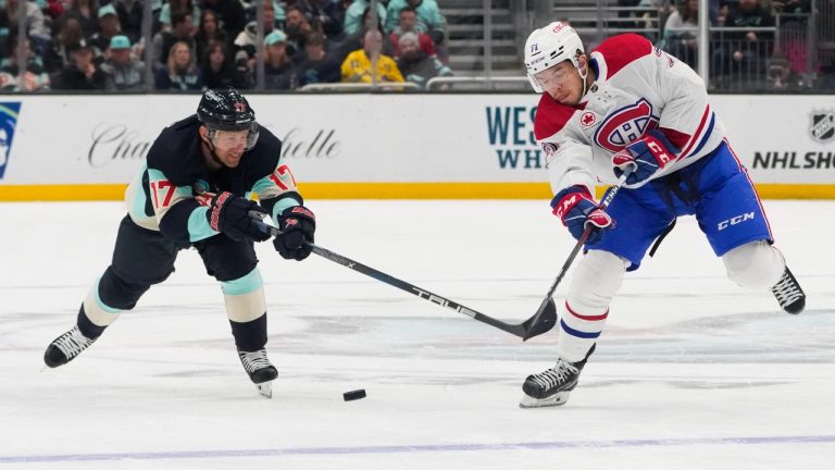 Seattle's Jaden Schwartz checks Montreal Canadiens centre Jake Evans. (AP)