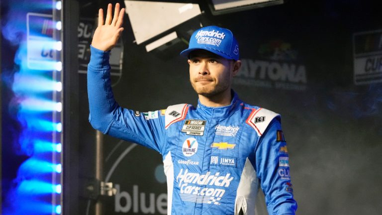 Kyle Larson waves to fans during driver introductions before Daytona 500 qualifying auto races at Daytona International Speedway, Thursday, Feb. 15, 2024, in Daytona Beach, Fla. (John Raoux/AP)