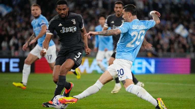 Juventus' Bremer, left, challenges for the ball with Lazio's Mattia Zaccagni during the Serie A soccer match between Lazio and Juventus at Rome's Olympic Stadium, Saturday, March 30, 2024. (Andrew Medichini/AP)