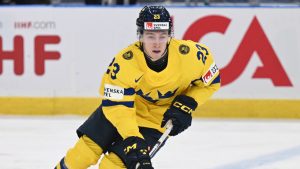 Sweden's Jonathan Lekkerimäki, left, in action during the IIHF World Junior Championship group A ice hockey match between Sweden and Latvia at Scandinavium in Gothenburg, Sweden, Tuesday, Dec. 26, 2023. (Björn Larsson Rosvall/TT News Agency via AP)