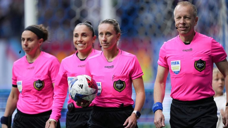 FILE - Referee Tori Penso, second from right; fourth official Felisha Mariscal, second from left; and assistant referees Brooke Mayo, left, and Corey Rockwell, right, walk onto the field before the Vancouver Whitecaps and Colorado Rapids played in an MLS soccer match. (Darryl Dyck/The Canadian Press via AP, File)