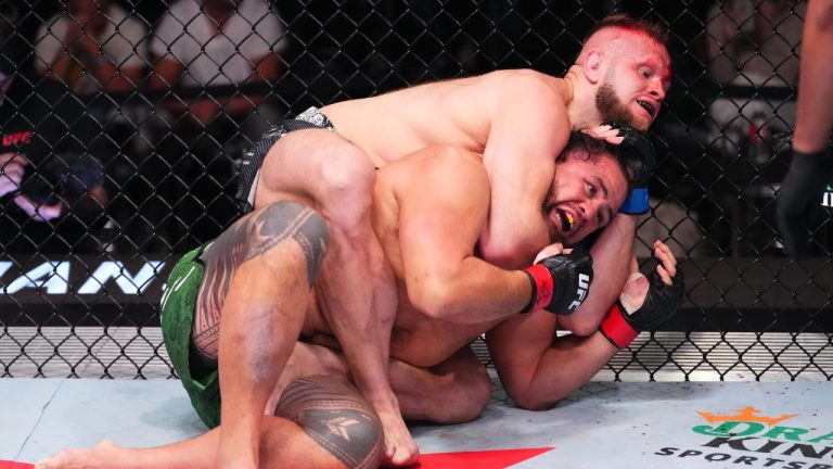 Marcin Tybura of Poland attempts to submit Tai Tuivasa of Australia in their heavyweight fight during the UFC Fight Night event at UFC APEX on March 16, 2024 in Las Vegas, Nevada. (Jeff Bottari/Zuffa LLC via Getty Images)