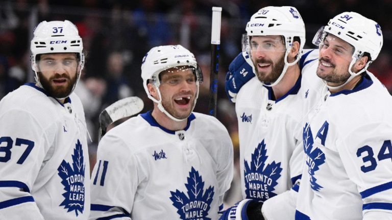 Toronto Maple Leafs centre Auston Matthews (34) celebrates his goal with defenceman Timothy Liljegren (37), centre Max Domi (11) and defenceman Joel Edmundson (20) during the second period of an NHL hockey game against the Washington Capitals, March 20, 2024, in Washington. (AP)