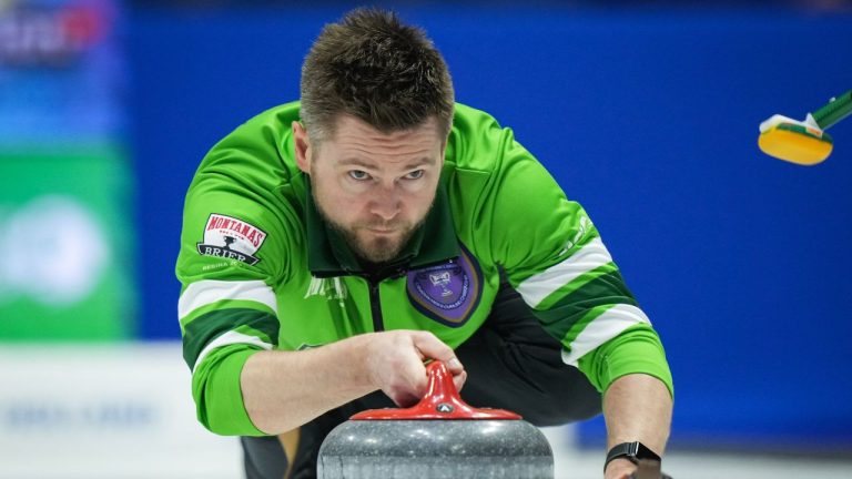 Saskatchewan skip Mike McEwen delivers a rock while playing Team Alberta-Bottcher during the semifinal at the Brier, in Regina, on Sunday, March 10, 2024. (Darryl Dyck/CP Photo)