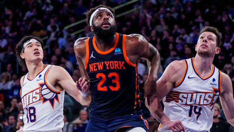 New York Knicks center Mitchell Robinson (23) fights for rebounding position against Phoenix Suns forwards Yuta Watanabe (18) and Drew Eubanks (14) during the second half of an NBA basketball game in New York, Sunday, Nov. 26, 2023. (Peter K. Afriyie/AP)