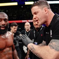 Cedric-Doumbe-listens-to-mixed-martial-arts-referee-Marc-Goddard-after-a-PFL-Europe-main-event-was-stopped-after-Doumbe-sustained-a-bizarre-injury-when-a-piece-of-glass-got-stuck-in-his-toe-during-the-fight