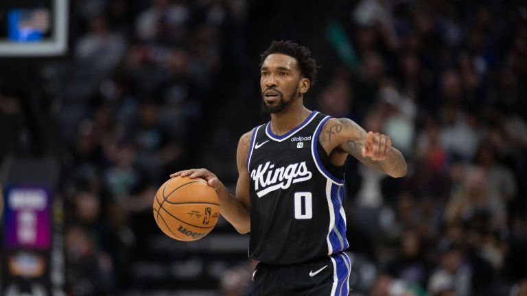 Sacramento Kings guard Malik Monk (0) brings the ball up court in the second half of an NBA basketball game against the Philadelphia 76ers in Sacramento, Calif., Monday, March 25, 2024. The Kings won 108-96. (José Luis Villegas/AP)