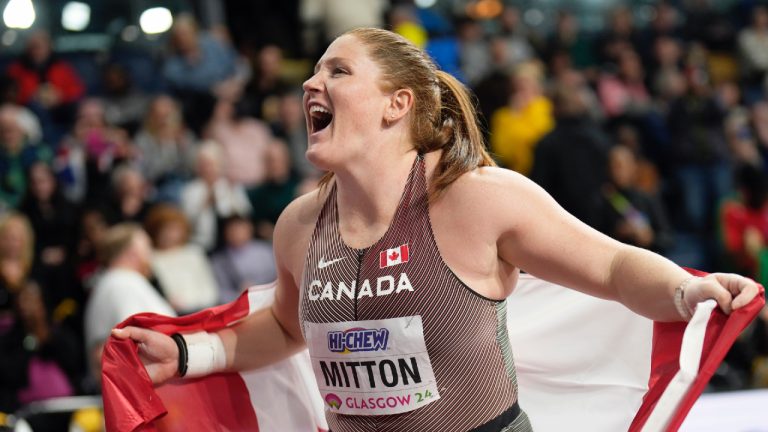 Sarah Mitton, of Canada, celebrates after winning the gold medal in the women's shot put during the World Athletics Indoor Championships at the Emirates Arena in Glasgow, Scotland, Friday, March 1, 2024. (Bernat Armangue/AP)