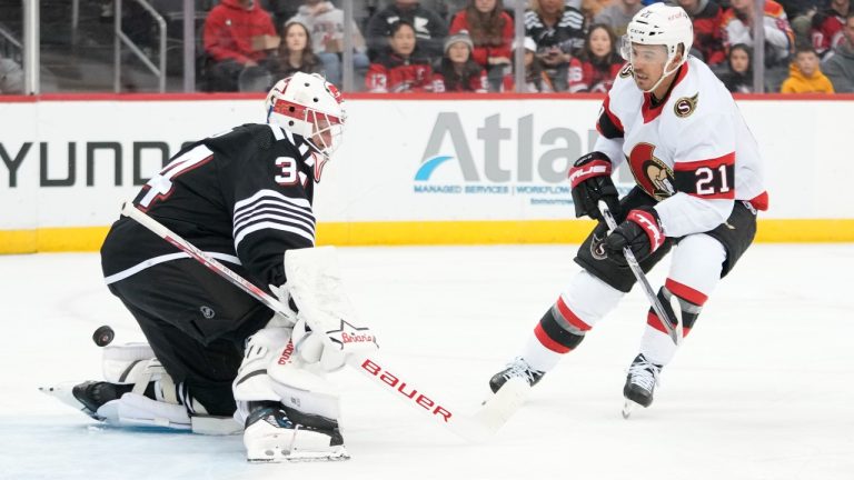 Ottawa Senators right wing Mathieu Joseph (21) scores past New Jersey Devils goaltender Kaapo Kahkonen (31) during the first period of an NHL hockey game, Saturday, March 23, 2024, in Newark, N.J. (Mary Altaffer/AP)