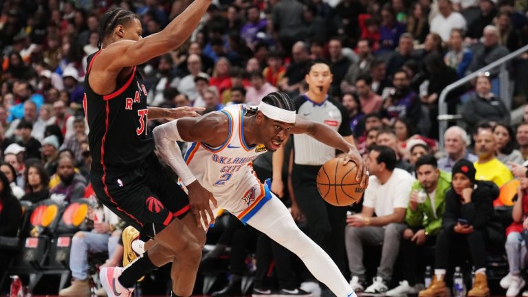 Oklahoma City Thunder guard Shai Gilgeous-Alexander (2) drives past Toronto Raptors guard Jahmi'us Ramsey (37) during second half NBA basketball action in Toronto on Friday, March 22, 2024. THE CANADIAN PRESS/Nathan Denette