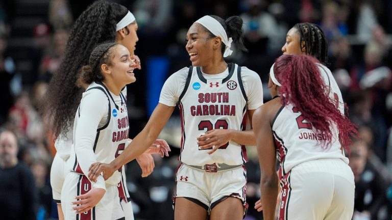 South Carolina players celebrate as time winds off the clock against Oregon State during an Elite Eight round college basketball game during the NCAA Tournament, Sunday, March 31, 2024, in Albany, N.Y. (AP Photo/Mary Altaffer)