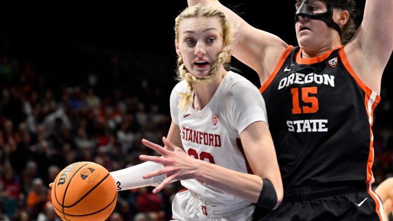 Stanford forward Cameron Brink, left, drives the ball against Oregon State forward Raegan Beers (15) during the second half of an NCAA college basketball game in the semifinal round of the Pac-12 tournament Friday, March 8, 2024, in Las Vegas. (David Becker/AP)