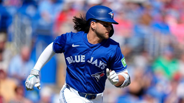 Toronto Blue Jays' Bo Bichette watches his single in the fifth inning of a spring training baseball game against the Philadelphia Phillies Monday, March 4, 2024, in Dunedin, Fla. (Charlie Neibergall/AP)