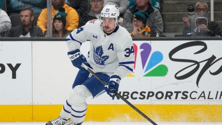 Toronto Maple Leafs center Auston Matthews (34) skates with the puck against the San Jose Sharks during the first period of an NHL hockey game in San Jose, Calif., Saturday, Jan. 6, 2024. (Jeff Chiu/AP)