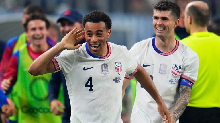 United States midfielder Tyler Adams (4) celebrates his goal with forward Christian Pulisic during the first half of a CONCACAF Nations League final soccer match against Mexico, Sunday, March 24, 2024, in Arlington, Texas. (Julio Cortez/AP)