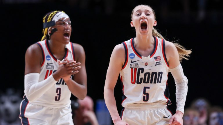 UConn guard Paige Bueckers (5) and forward Paige Bueckers (3) react during the first half of the team's Sweet 16 college basketball game against Duke in the women's NCAA Tournament, Saturday, March 30, 2024, in Portland, Ore. (Howard Lao/AP)