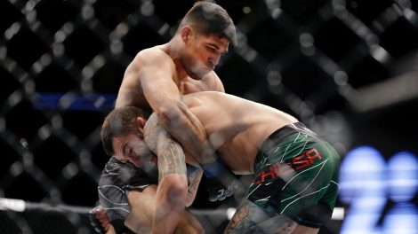 Vicente-Luque-grapples-with-Michael-Chiesa-during-their-welterweight-mixed-martial-arts-bout-at-UFC-265