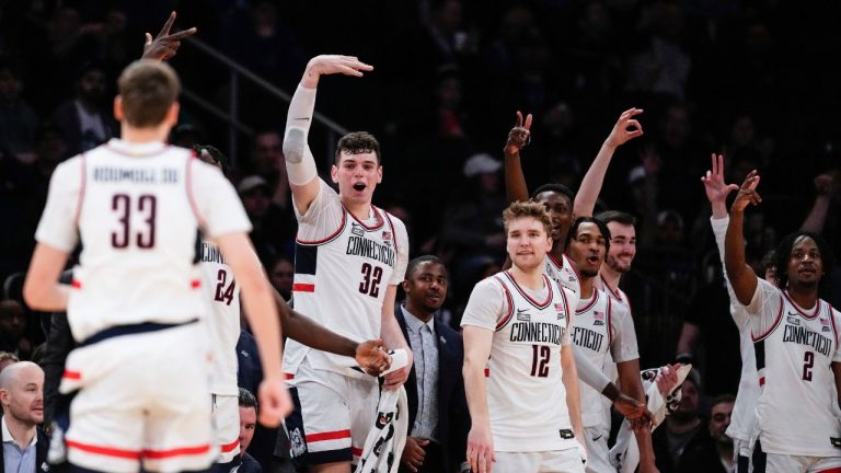 UConn's Cam Spencer Donovan Clingan and Tristen Newton celebrate a three-point shot by Apostolos Roumoglou during the second half of an NCAA college basketball game against Xavier in the quarterfinal round of the Big East Conference tournament, Thursday, March 14, 2024, in New York. (Frank Franklin II/AP Photo)