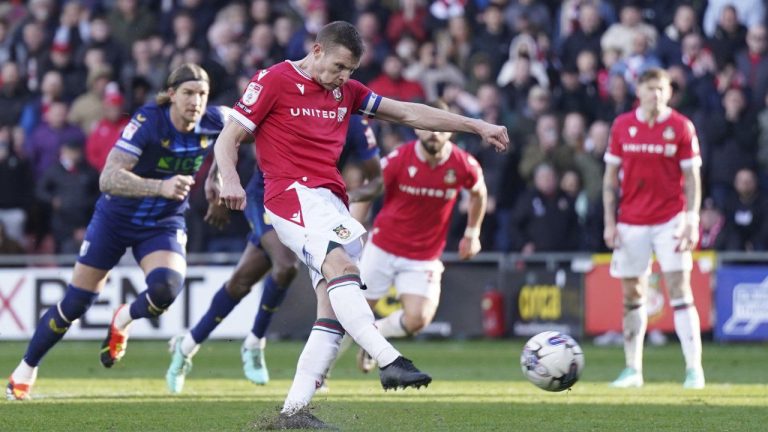 Wrexham's Paul Mullin scores their side's second goal from the penalty spot during the English League Two soccer match between Wrexham and Mansfield Town at the SToK Cae Ras in Wrexham, Wales, Friday, March 29, 2024. (Jacob King/PA via AP)