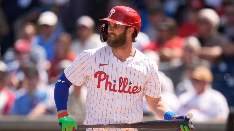 Philadelphia Phillies' Bryce Harper walks to the dugout after striking out in the sixth inning of a spring training baseball game against the New York Yankees Monday, March 11, 2024, in Clearwater, Fla. (Charlie Neibergall/AP)