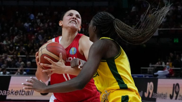 Canada's Natalie Achonwa attempts a shot on goal as Australia's Ezi Magbegor, right, blocks during their bronze medal game at the women's Basketball World Cup in Sydney, Australia, Saturday, Oct. 1, 2022. (Mark Baker/AP)